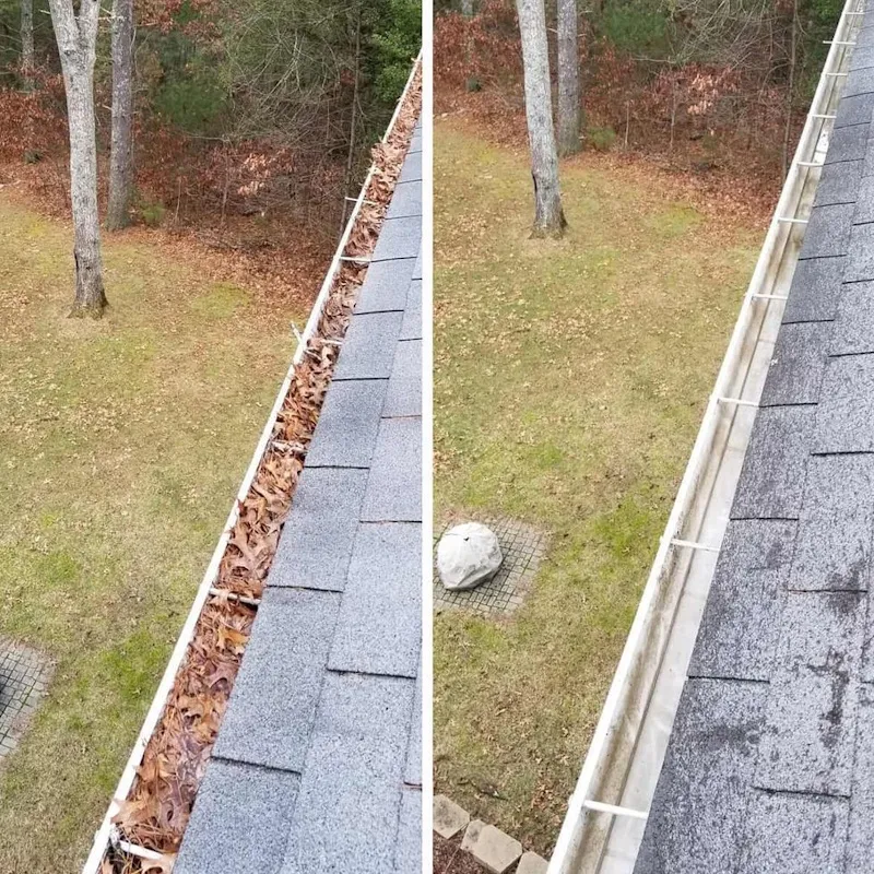 Gutter cleaning service removing leaf debris from gutters on a Portland, Oregon home
