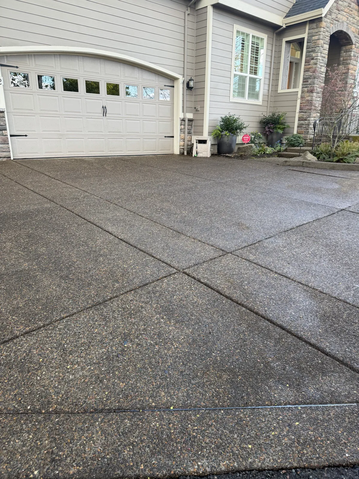 After: the same aggregate driveway clean and even in color